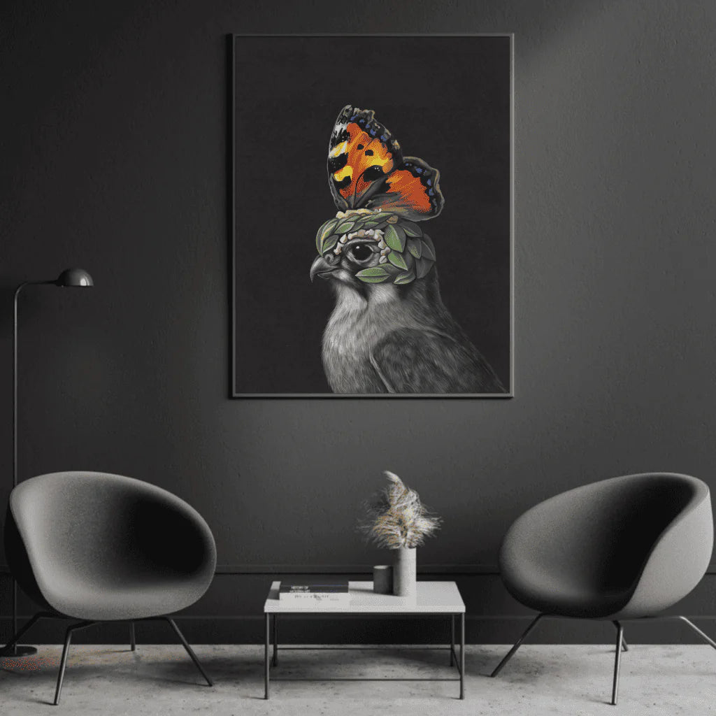 A striking canvas artwork featuring a regal hawk with a surreal twist — its head adorned with green leaves and a vivid orange butterfly perched like a crown. Set against a deep black background, the image blends realism with fantasy, highlighting transformation and duality. Displayed in a sleek, modern room with dark tones and minimalist furniture, the piece adds a bold, imaginative focal point.