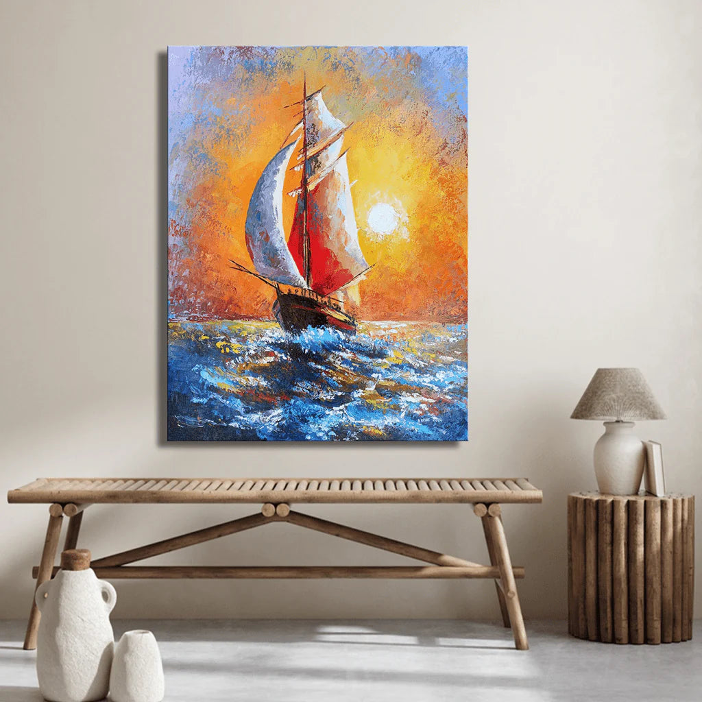Framed canvas wall art depicting a serene early morning sea voyage, with a small sailboat drifting on calm waters under a warm, golden-pink dawn sky.